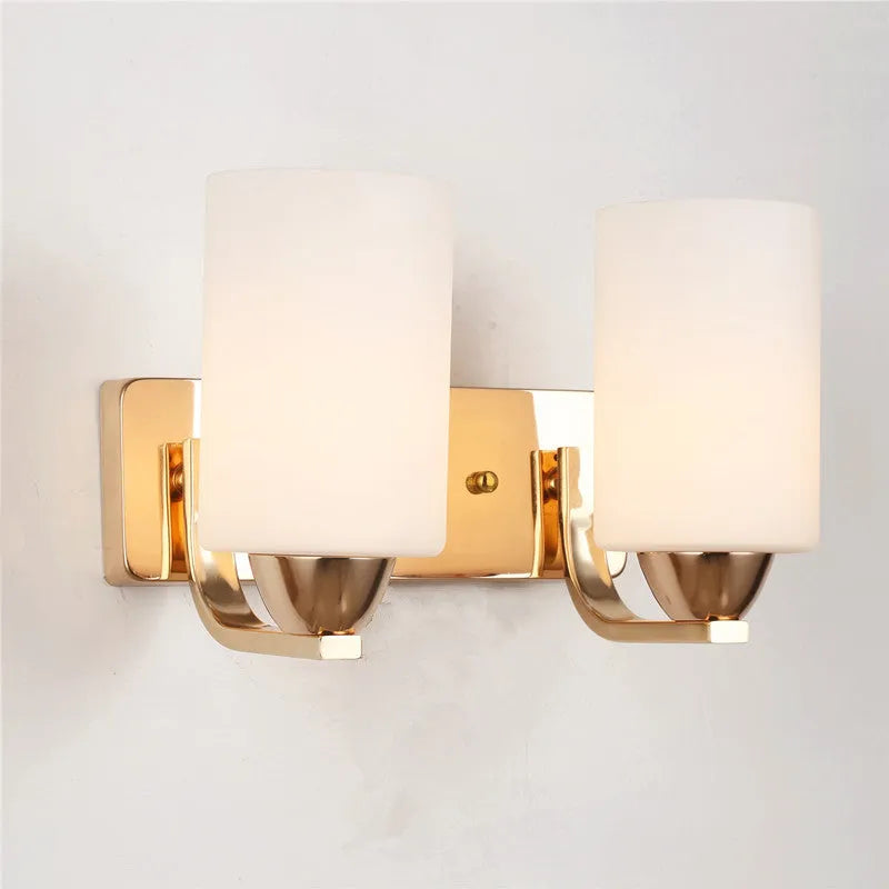 Minimalist chrome wall lamp with a glass shade shown in single head and double head configurations