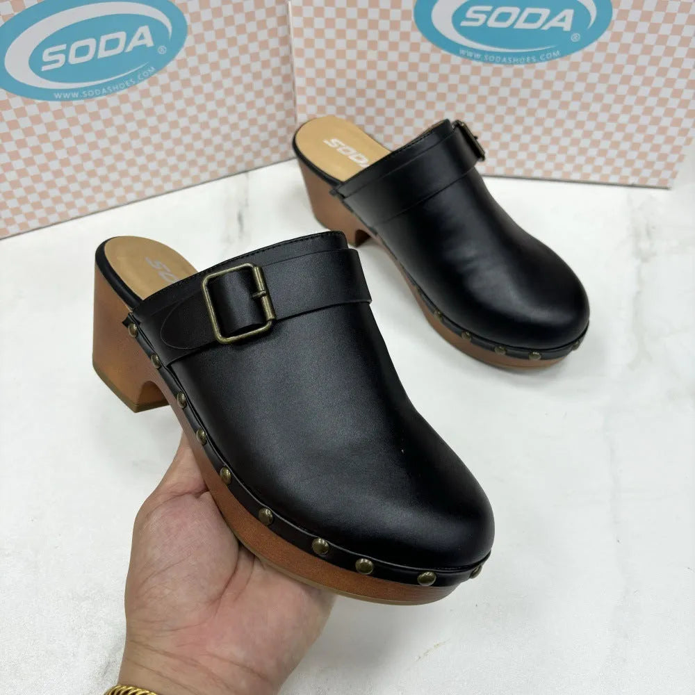 Black retro women's slippers with a chunky block heel, closed toe, rivet details, and a rubber sole.