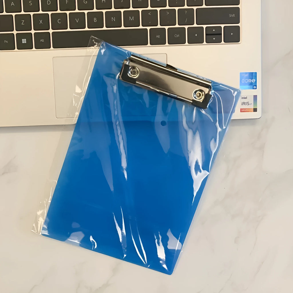 A4 transparent plate holder writing board with metal clip, shown in blue on a desk.