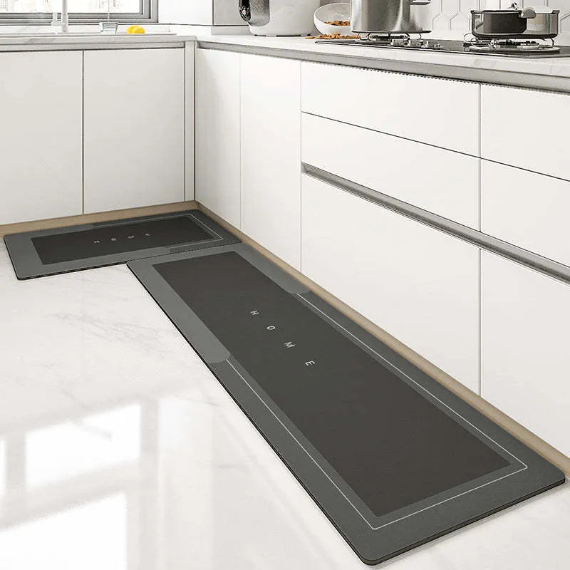 Blended fibre machine woven bathroom floor mat in blue, shown in an oval shape on a tiled floor.