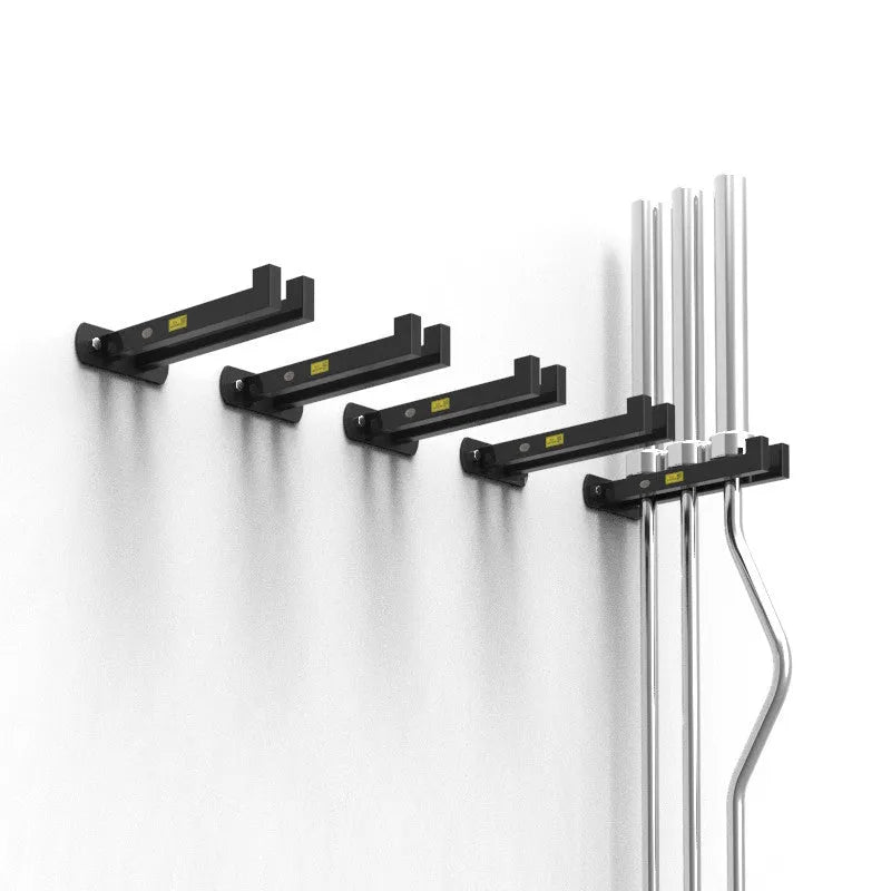 Wall mounted steel barbell holder in matte black finish holding multiple bars in home gym