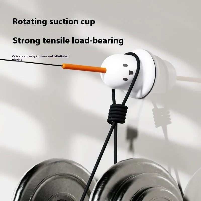 Cat toy strong suction cup cat teaser in green plastic with suction cup base on a smooth surface