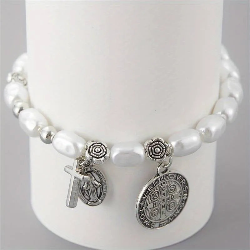 Silver beaded flower bracelet on display with metal links