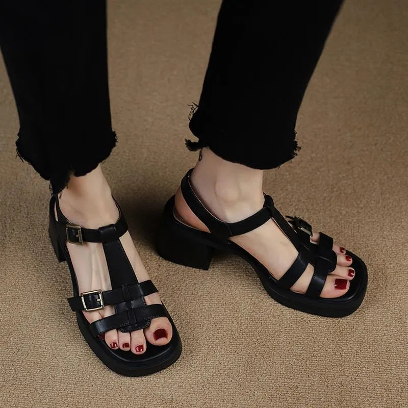 Women's black retro high heel sandals with a T-shaped buckle and chunky platform sole.