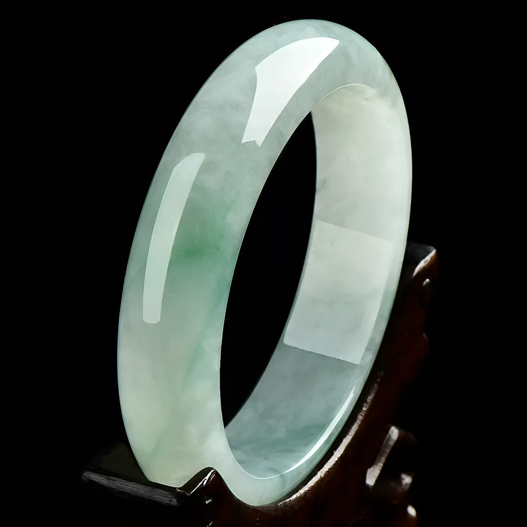 Light green jade bracelet showing natural stone texture on wrist