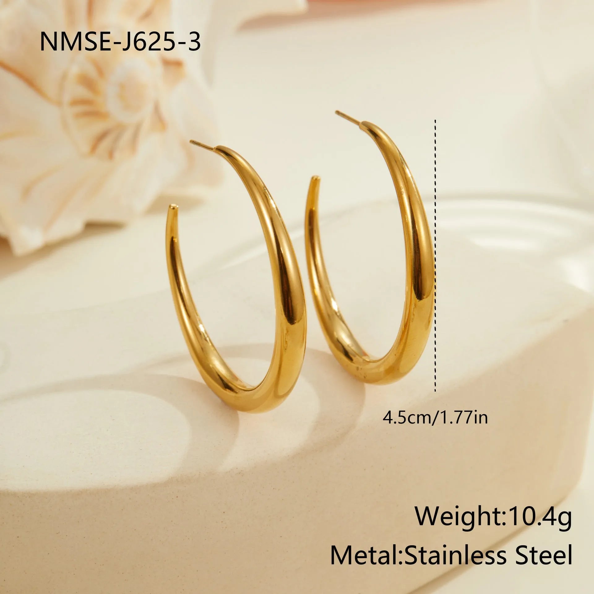 Titanium steel hoop earrings in geometric round design with gold or steel finishes