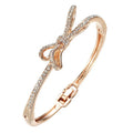 Rose gold electroplated copper women's bracelet with bow and diamond accents