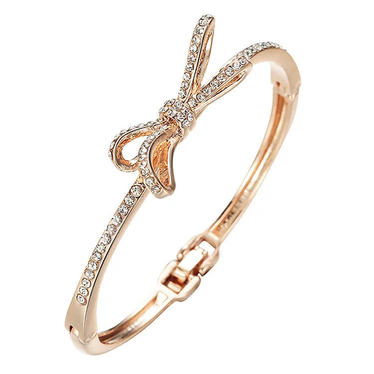 Rose gold electroplated copper women's bracelet with bow and diamond accents
