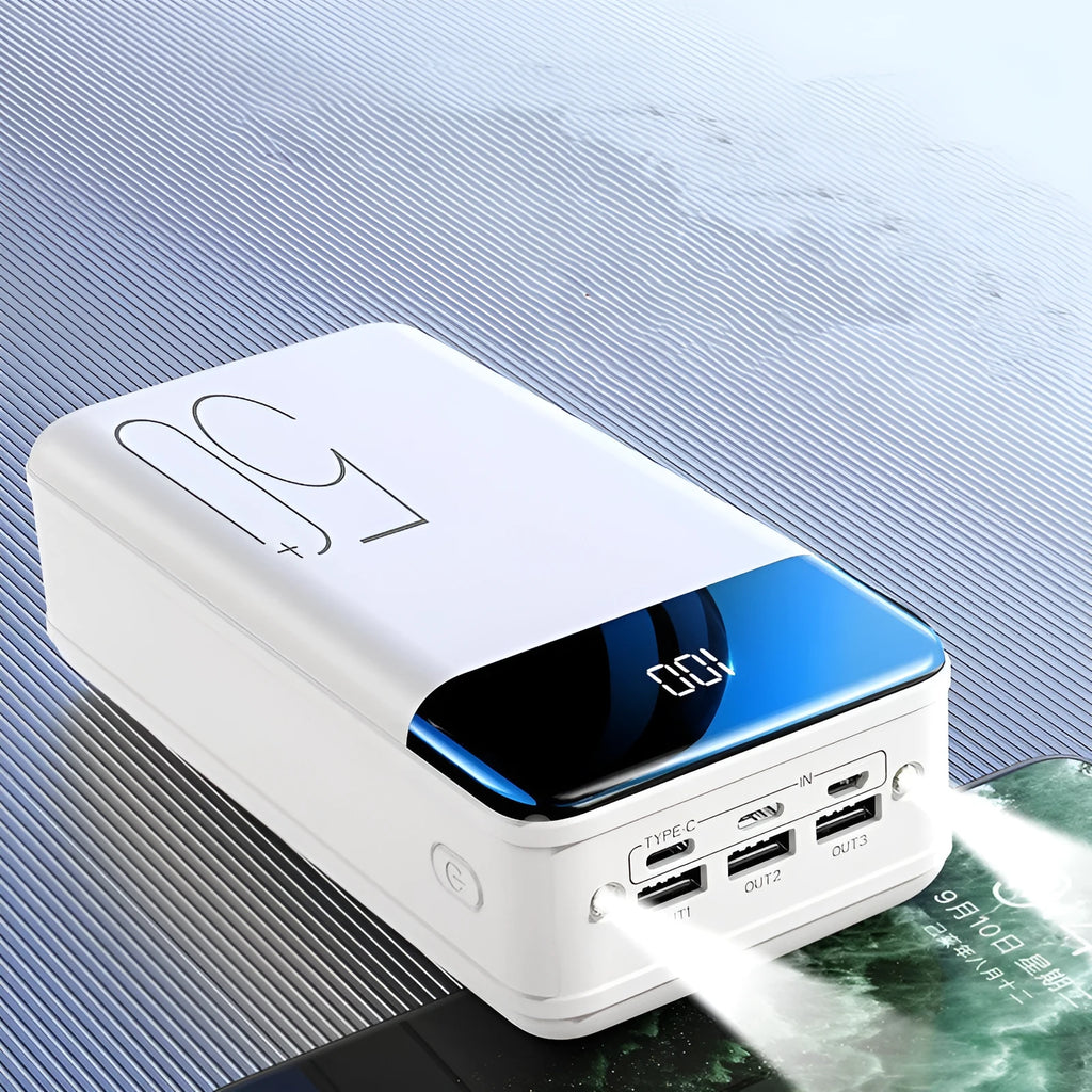 Black and white large 50000mAh power bank with three USB ports showing size scale