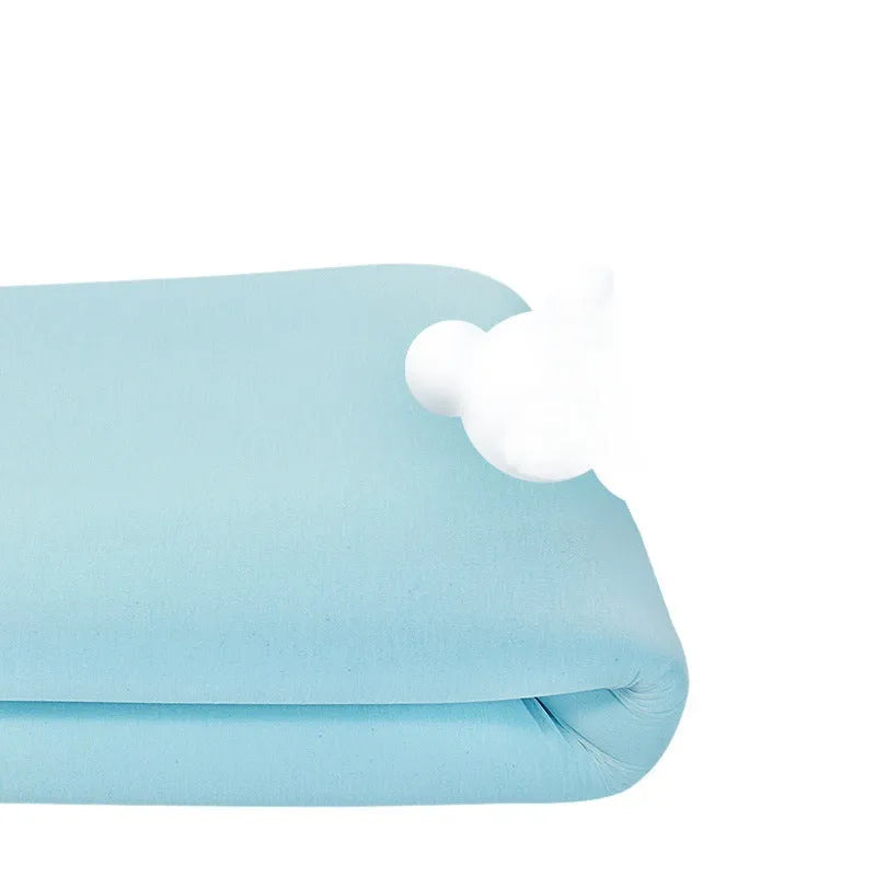 Thin gel memory foam tatami mattress on a floor, showing its slim profile and regenerated cellulose fabric cover.