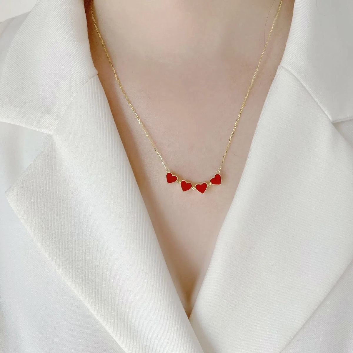 Red magnetic four-leaf clover pendant necklace with gold-plated copper on titanium steel O-link chain