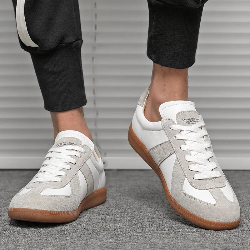 White Japanese-style retro low-top sneakers with matte upper and lace-up front
