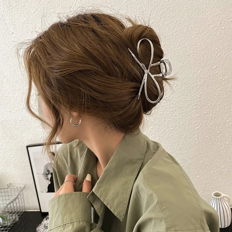 Women's Korean style bow hair barrette with alloy construction in silver or gold colour option