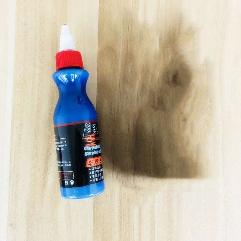Small blue car wiping tool with scratch repair agent bottle for automotive paintwork touch-up applications