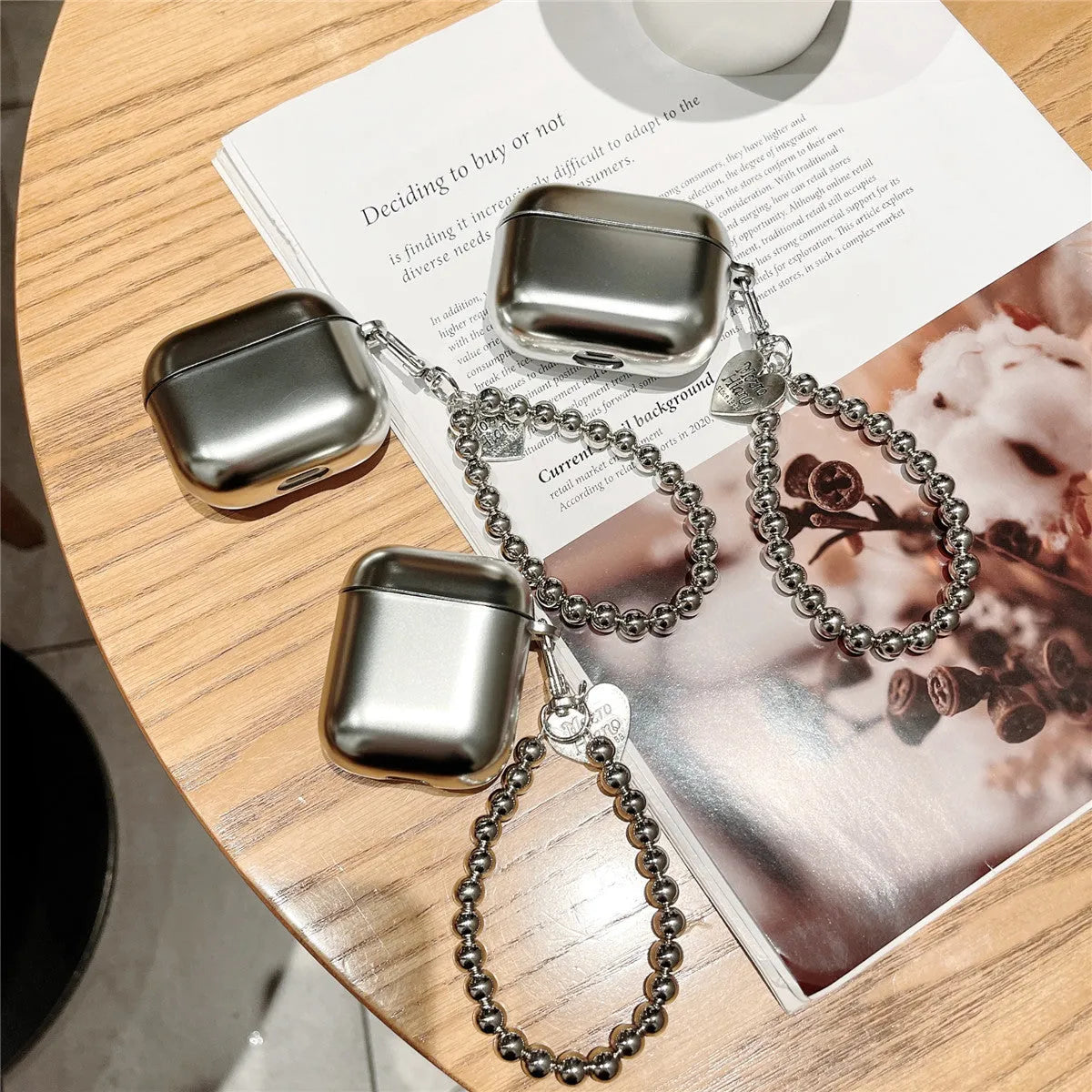 Matte plating protective case for Apple AirPods with an integrated carrying strap.