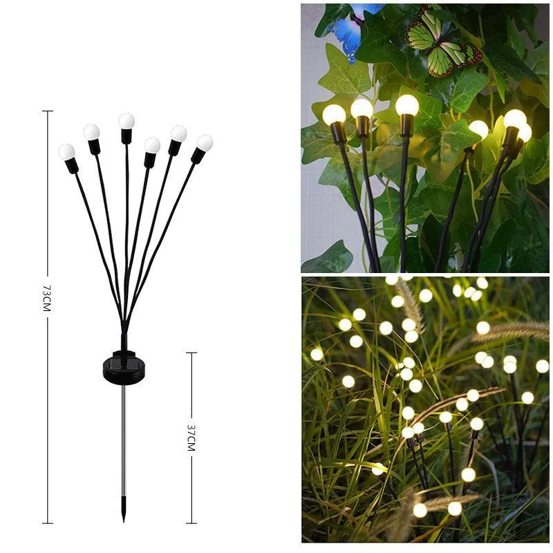 Solar-powered LED garden lamp with multiple light heads and ground plug stakes on a lawn