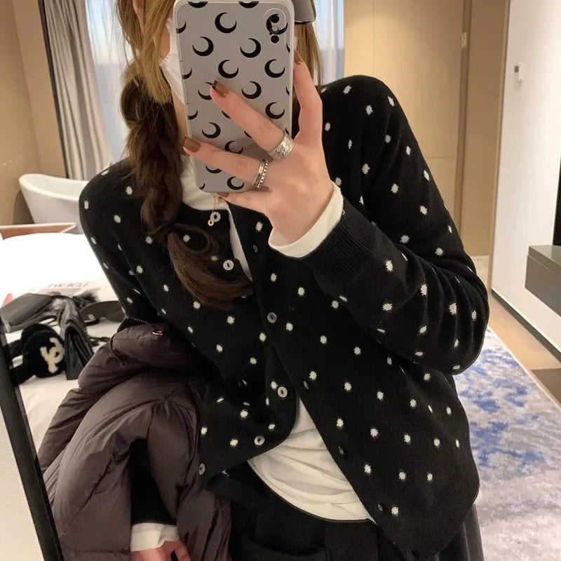 Women's grey dot knitted cardigan with crocheted flower detailing and long sleeves