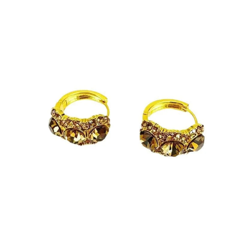 Gold metal hoop earrings with brown zircon stones in geometric shape