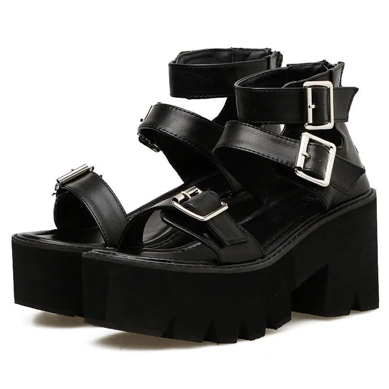 Black women's punk-style Roman sandals with a chunky platform heel and a back zipper closure.