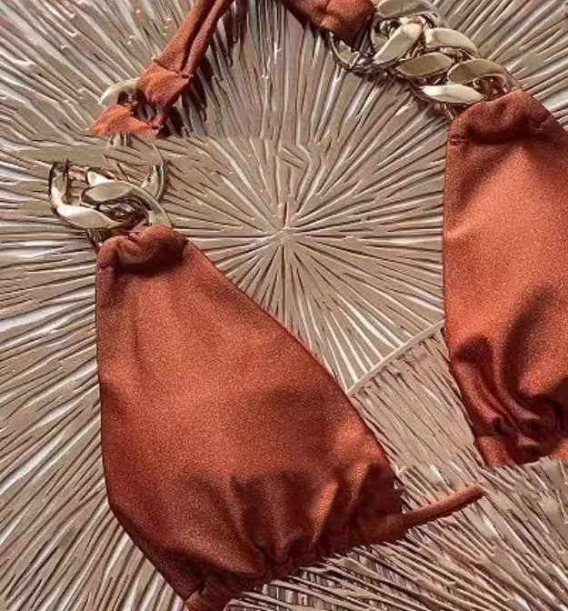 Brown tube-top push up bikini swimsuit with a ring tether detail on an adult female model.