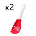 Red and black multifunctional plastic cooking spoon with serrated edges and slotted head on a grey background