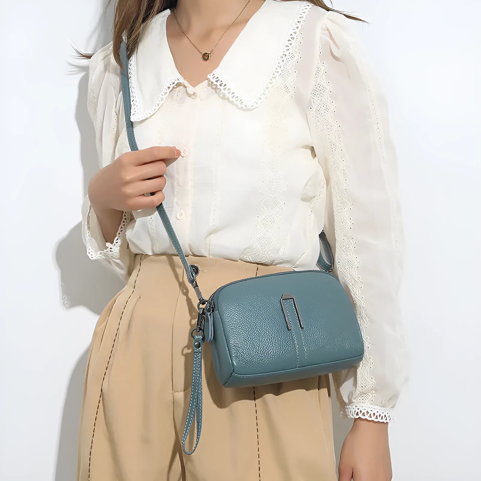 Genuine leather women's shoulder bag in horizontal square shape showing black, navy, green, brown colour options