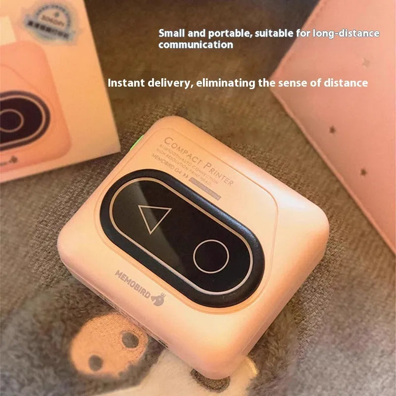Compact avocado green Bluetooth mini thermal printer for mobile phones next to a roll of paper.