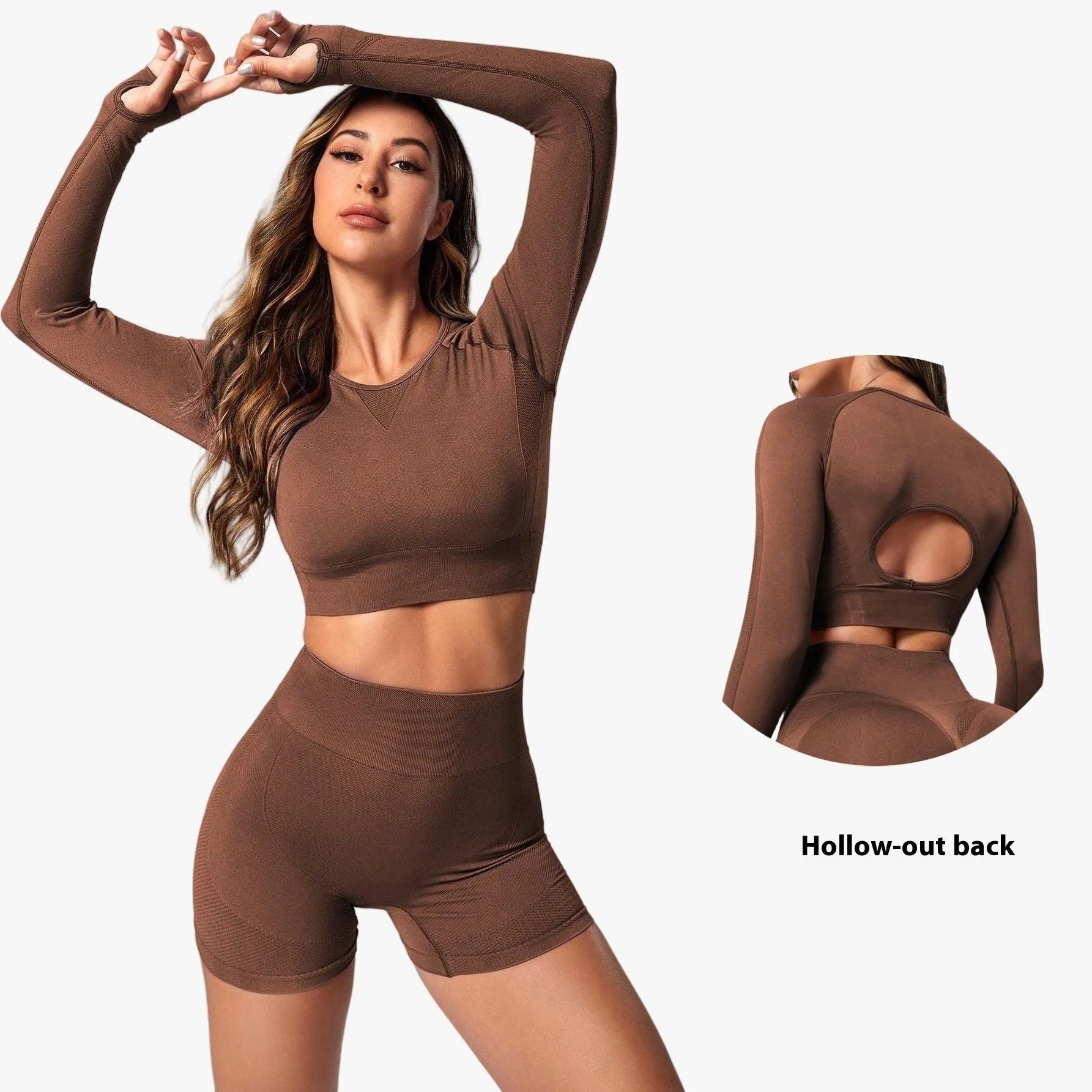 Women's black yoga set comprising a long sleeve top and high-waist trousers laid flat.