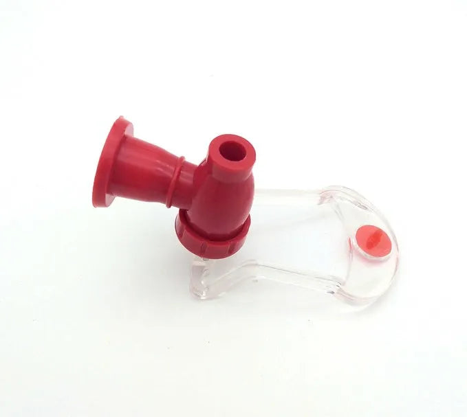 Red plastic Magic Tap soda dispenser for 2-litre bottles, 15 cm high, 10 cm diameter, with push-in tap.