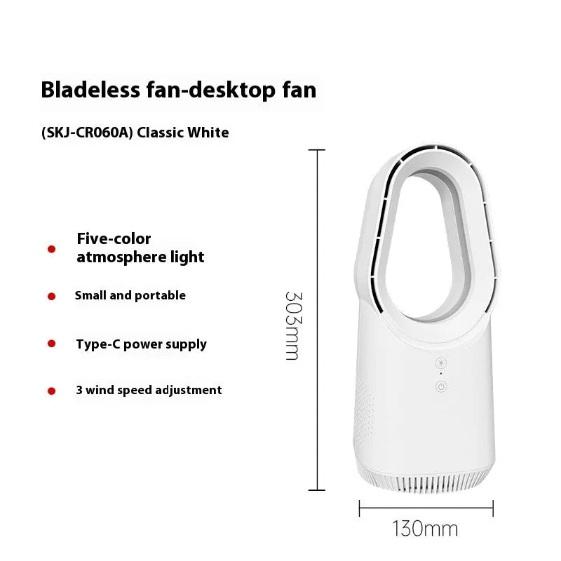 A white bladeless tower fan with a remote control on a wooden floor next to a desk.