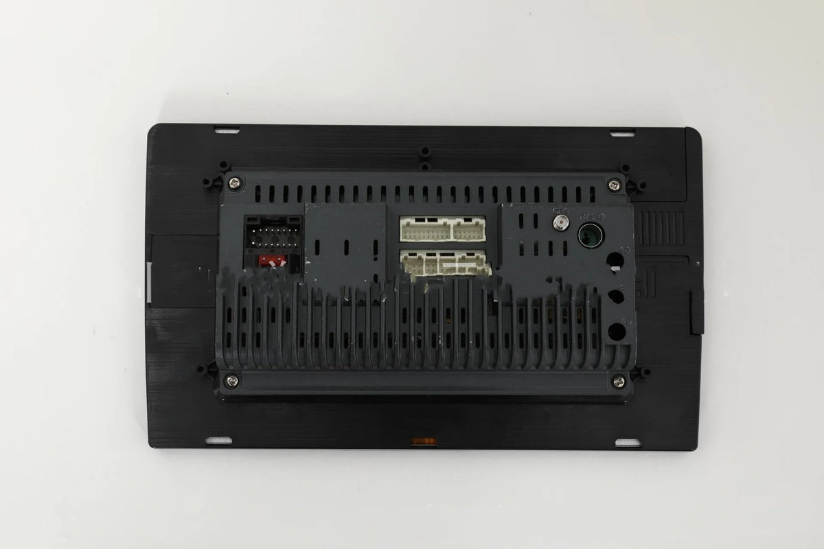 Black 10.1 inch universal Android car head unit with touch screen display on a trapezoidal panel
