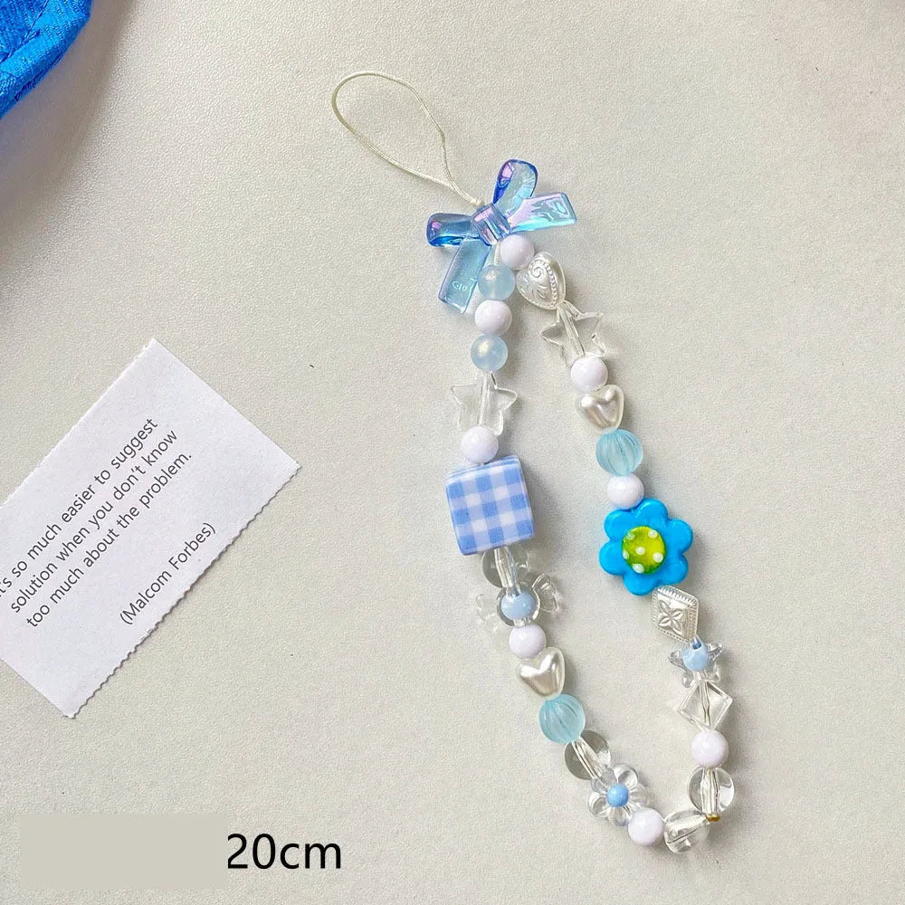 Beaded flower phone lanyard with floral charm on adjustable rope strap in blue, pink, or yellow