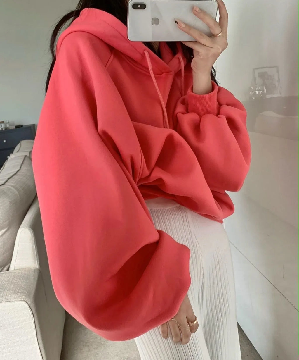 Watermelon red mulberry silk sleeveless hooded sweater on hanger showing loose fit and hood detail