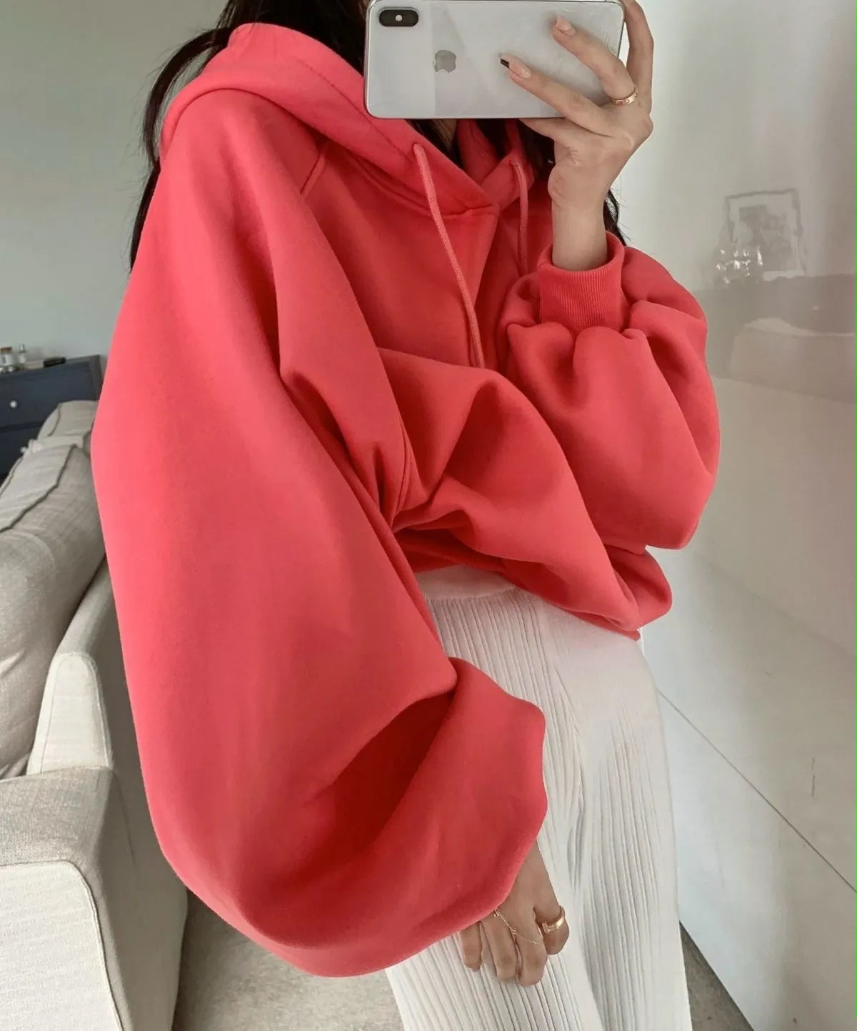 Watermelon red mulberry silk sleeveless hooded sweater on hanger showing loose fit and hood detail