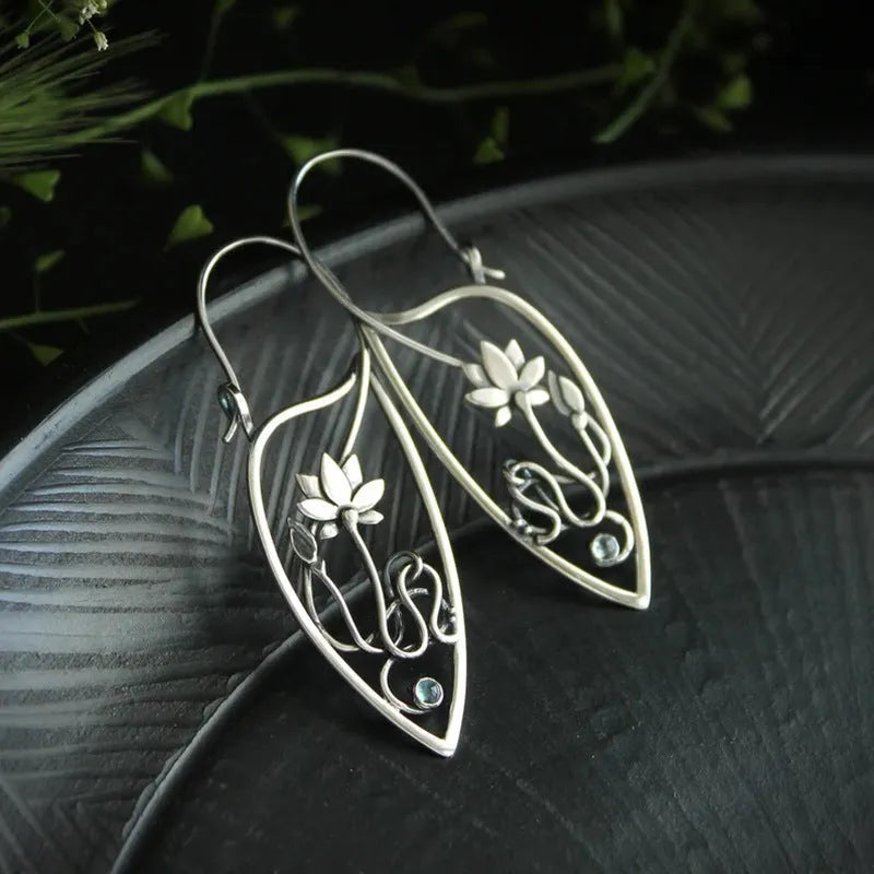 Silver lotus vine and geometric shape drop earrings with rhinestone accents