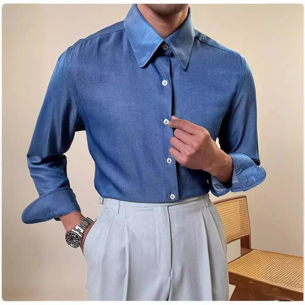 Men's slim fit long sleeve round collar shirt in a light blue colour, showcasing the button front and cuff detail.