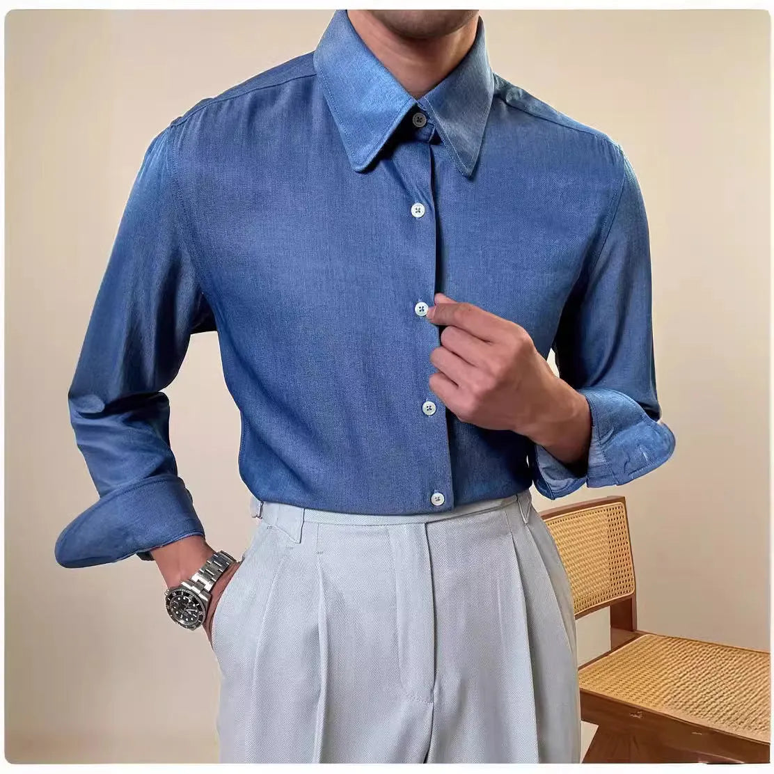 Men's slim fit long sleeve round collar shirt in a light blue colour, showcasing the button front and cuff detail.