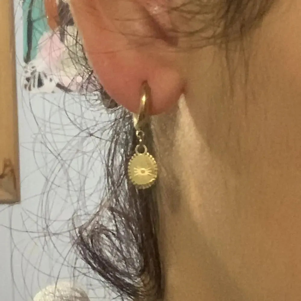 Silver geometric ellipse stud earrings for women made from stainless steel.