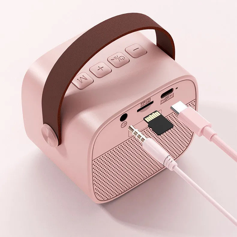 Wireless Bluetooth portable audio speaker with microphone in white, pink, or blue plastic housing