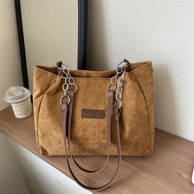 Corduroy one-shoulder tote bag in horizontal square shape with three-dimensional pocket
