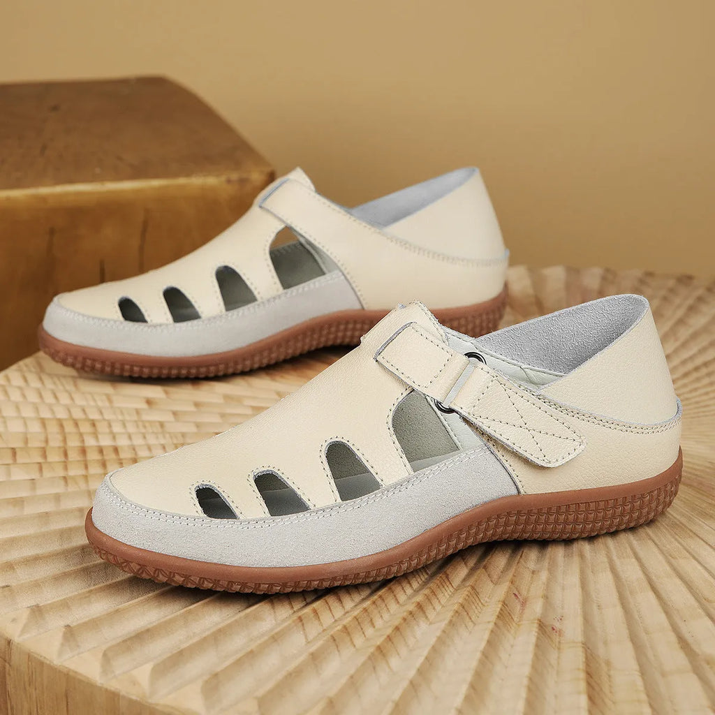 Women's plus size flat heel sandals with hollow out toe cap design in blue colour showing rubber sole