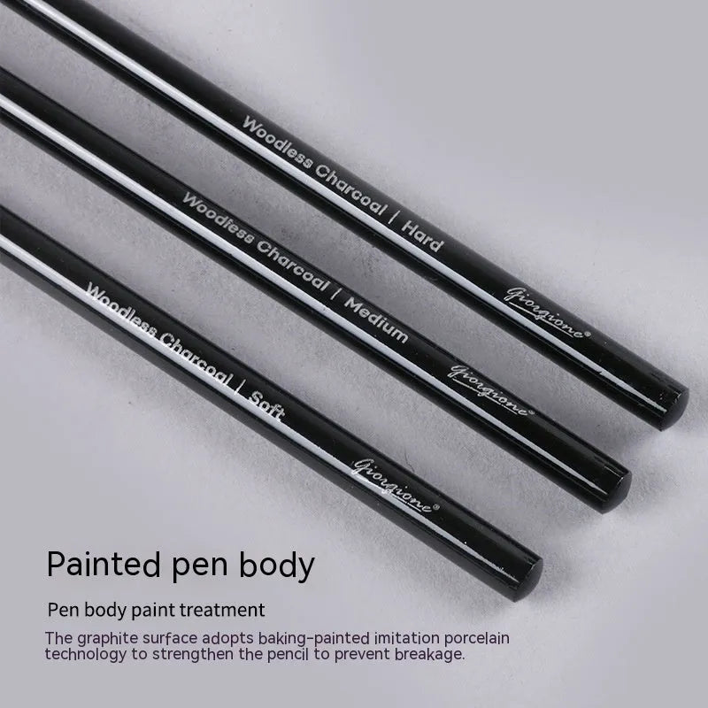 Set of six graphite and three carbonised drawing pencils with wooden shells on suction card packaging.