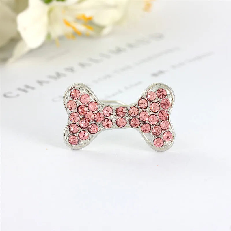 Rhinestone dog bone hair clip in alloy, shown in white, pink, blue, red and purple colour options.