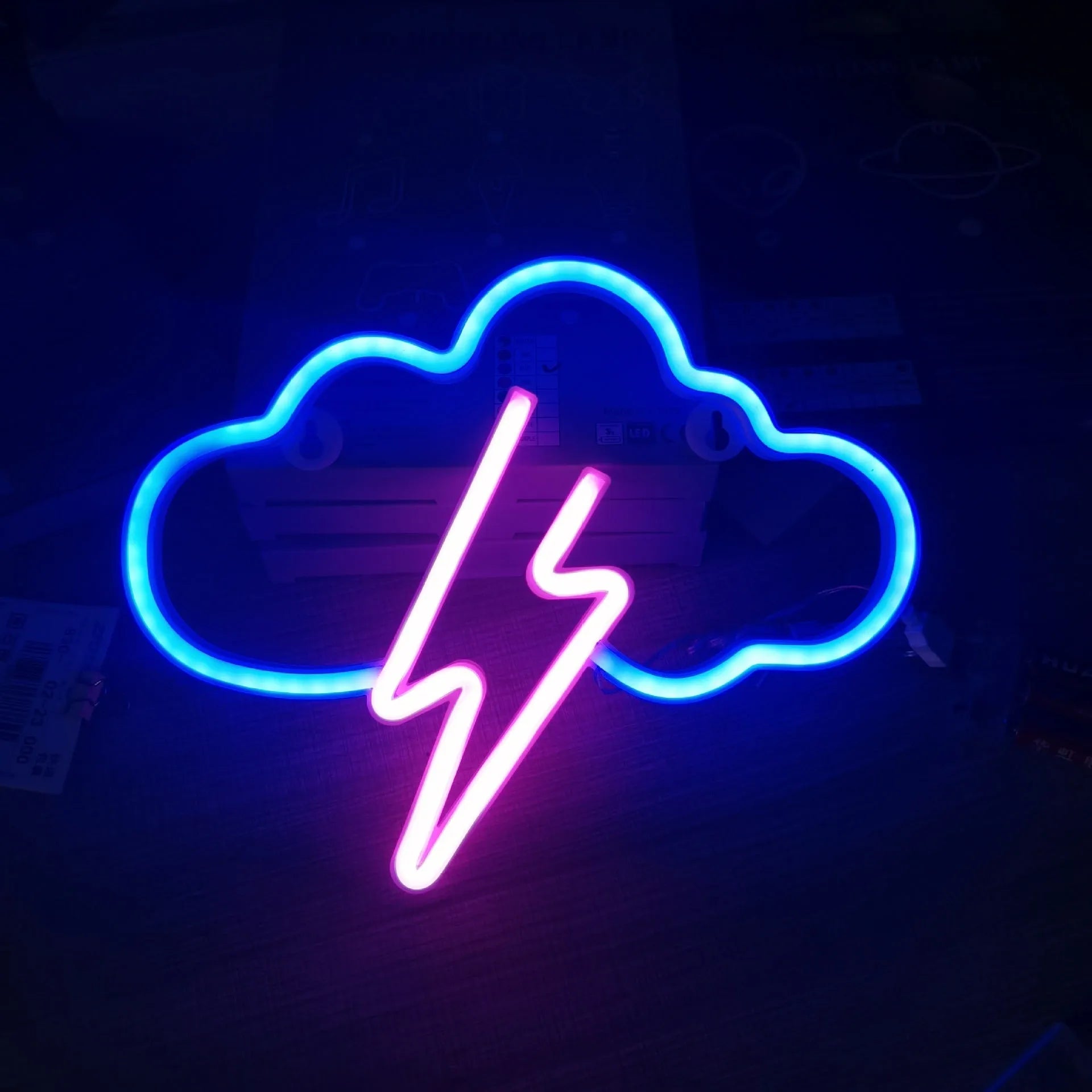 Halloween bat shaped neon light with plastic shell in pink and blue colour options on a dark background