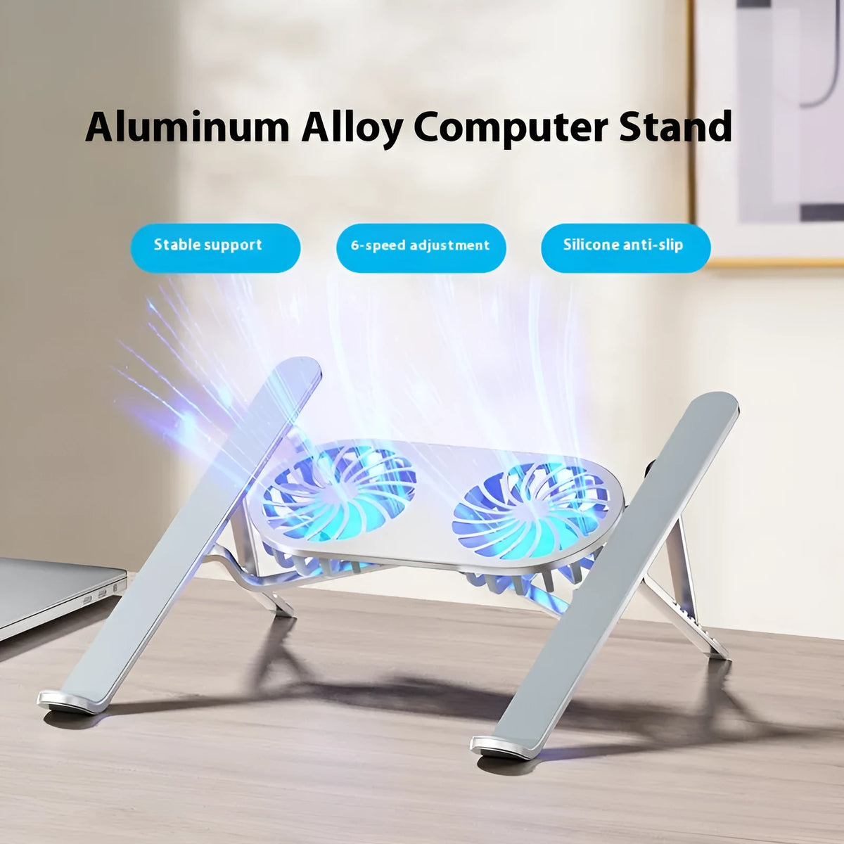 Silver aluminium laptop cooling stand with twin fans folded, next to its cloth storage bag and USB cable.