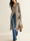 Khaki coloured long sleeve button-front cardigan with a French retro style on a hanger.