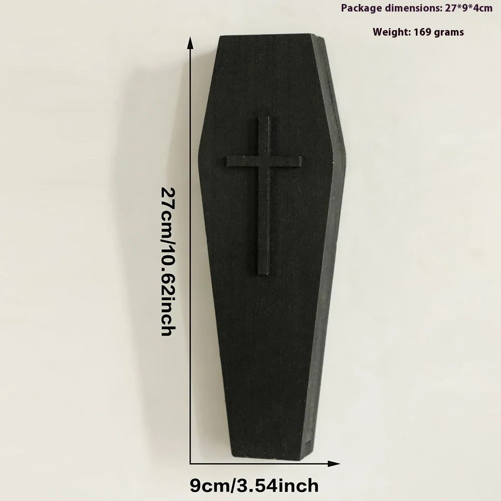 Black wooden cross-shaped wall shelf with dimensions 27cm by 9cm for displaying small decorative items.