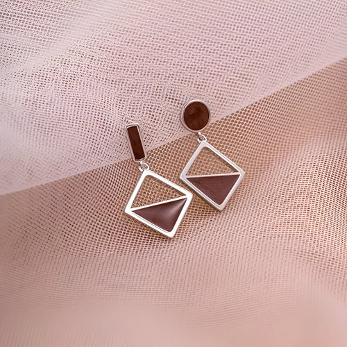 925 sterling silver asymmetrical stud earrings with frosty brown finish heart-shaped love motif on white background