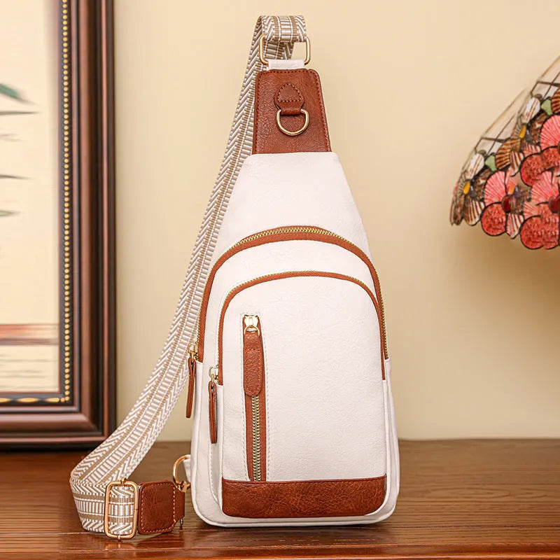 Soft PU women's crossbody bag in street-trend style with open pocket and sewing thread detail.