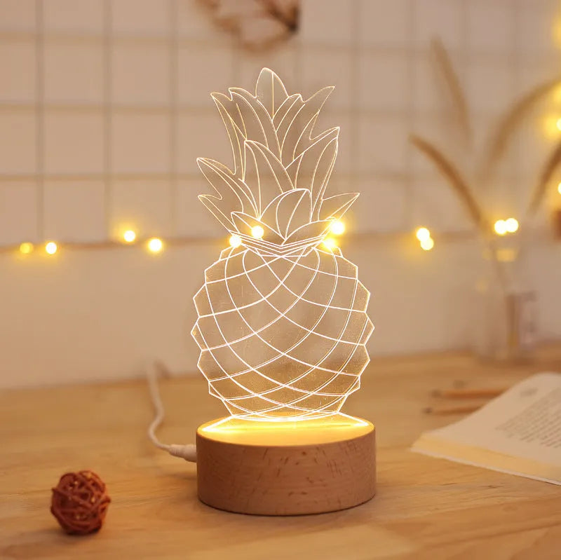 Cartoon pineapple-shaped night light with wooden base and acrylic shade on a table.